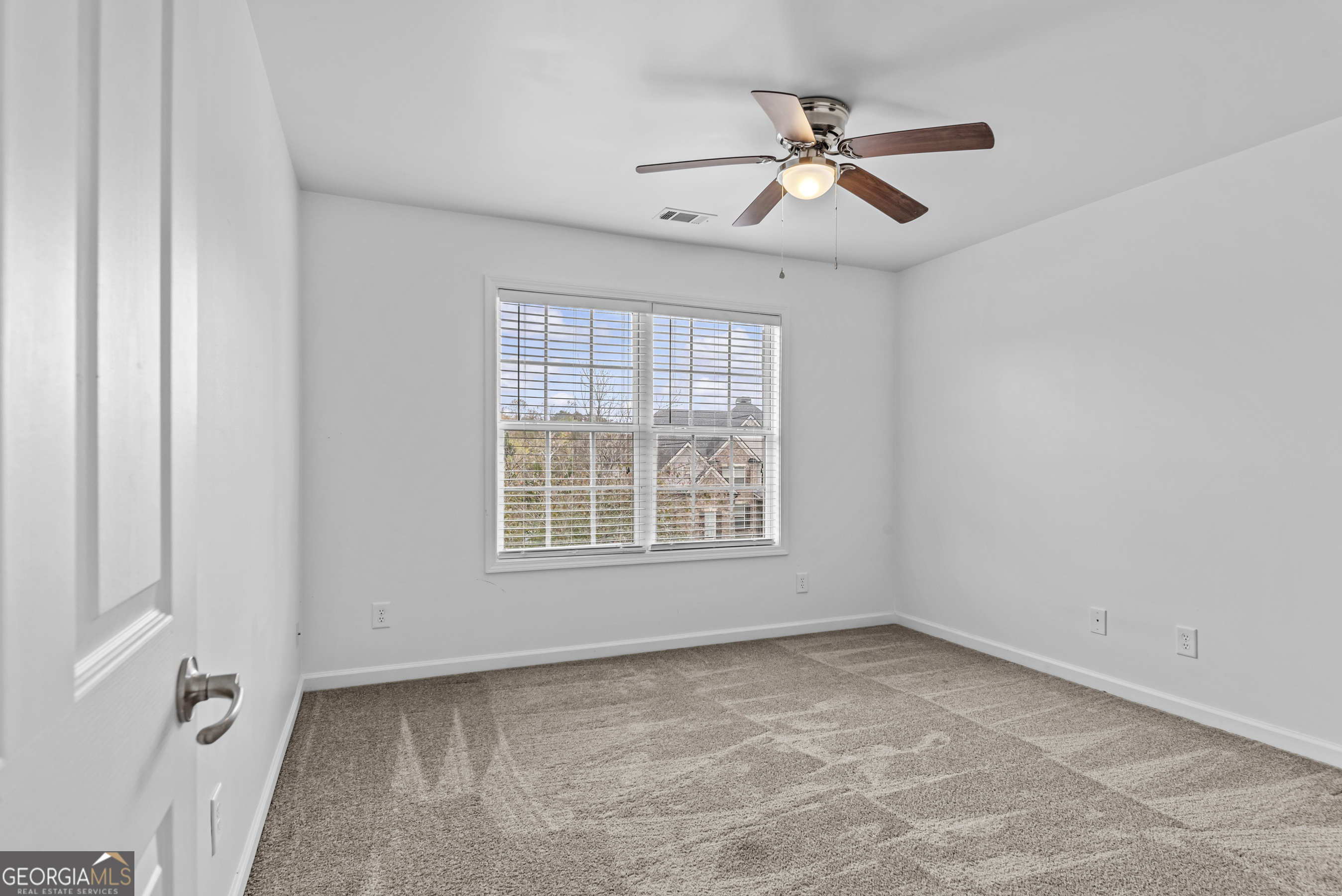 463 Delaperriere Loop Jefferson, GA 30549 - Photo 26 of 75 an empty room with chandelier fan and windows