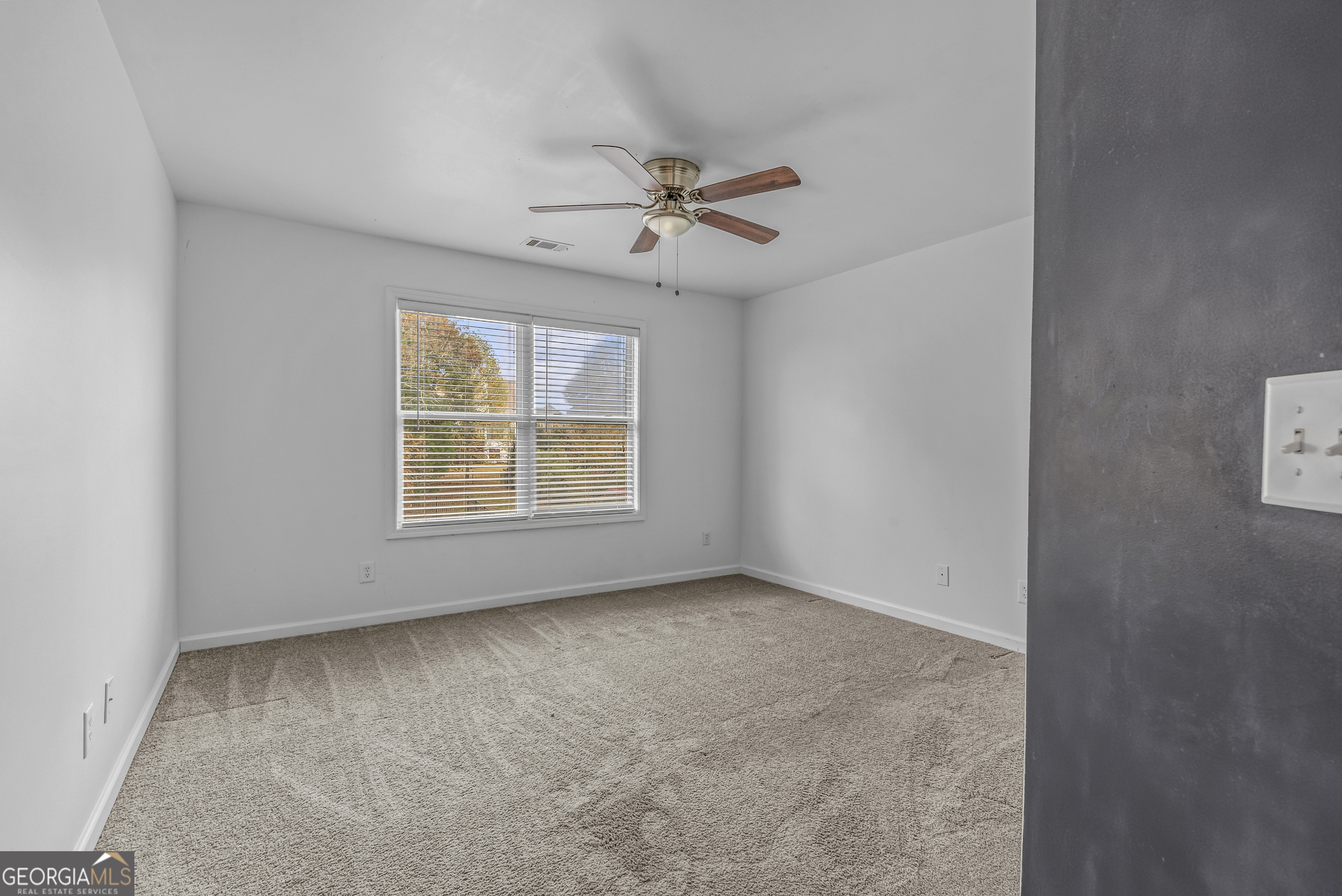 463 Delaperriere Loop Jefferson, GA 30549 - Photo 28 of 75 an empty room with windows and fan
