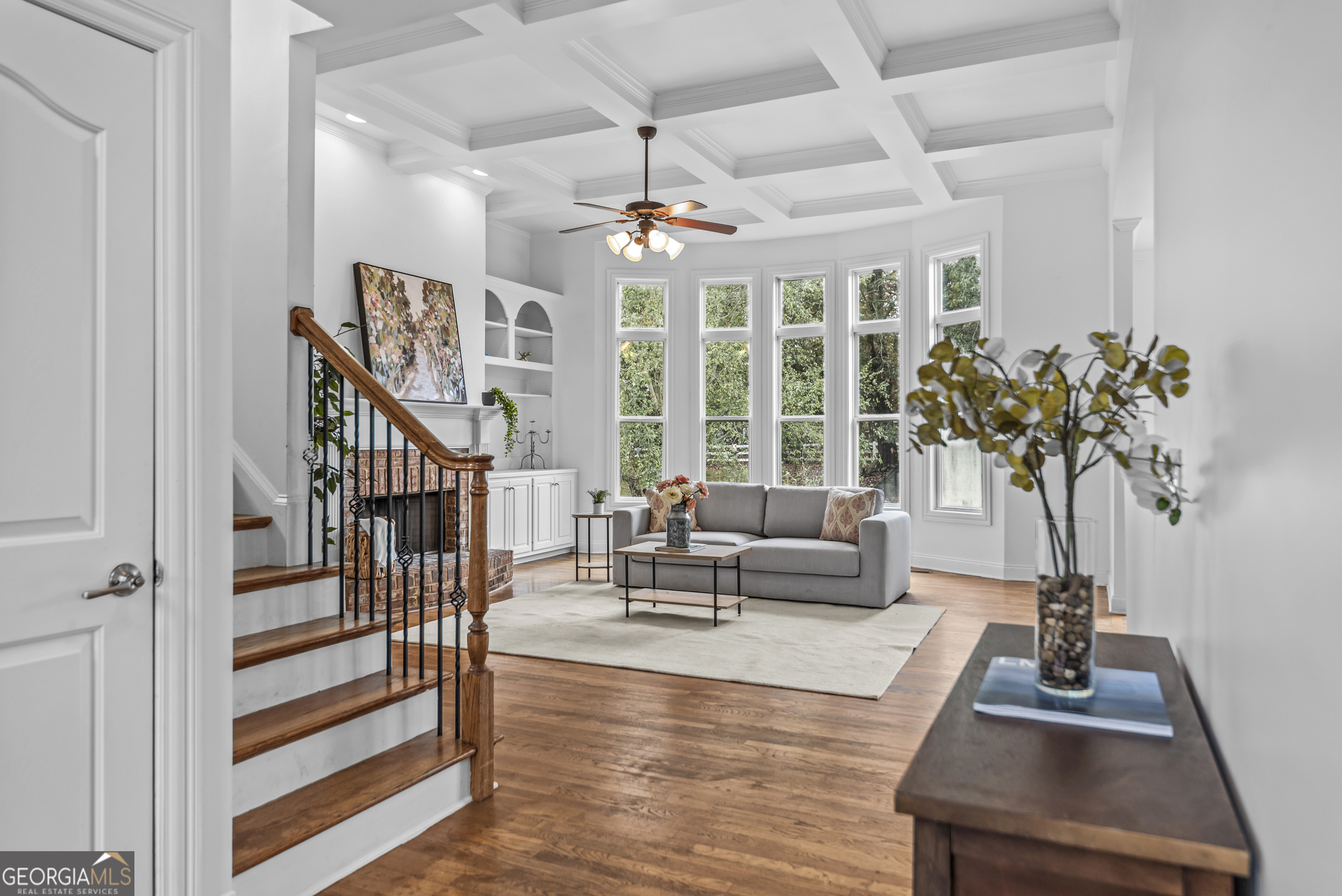 463 Delaperriere Loop Jefferson, GA 30549 - Photo 46 of 75 a living room with furniture a chandelier and a potted plant