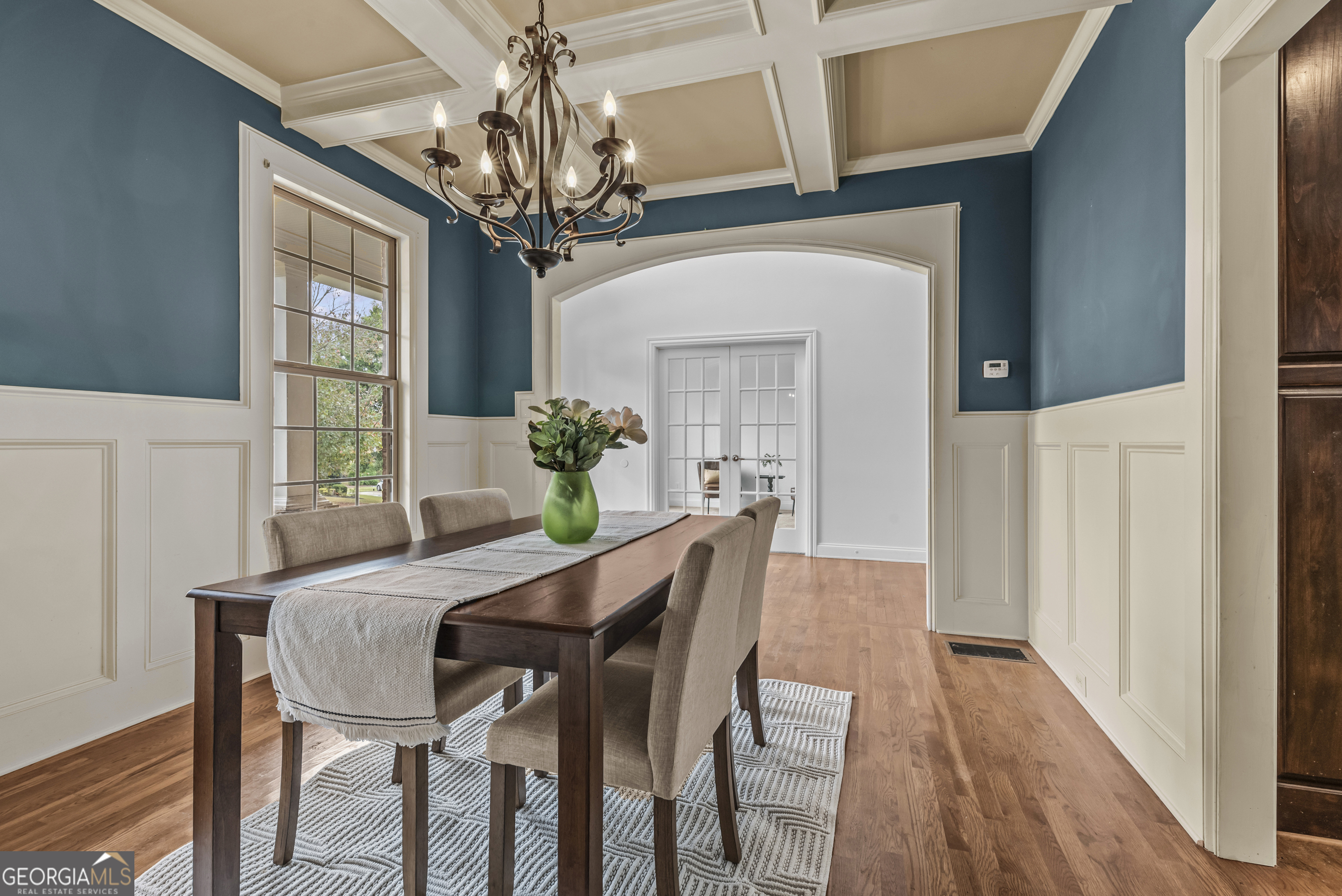 463 Delaperriere Loop Jefferson, GA 30549 - Photo 5 of 75 a dining room with furniture wooden floor a chandelier and a mirror