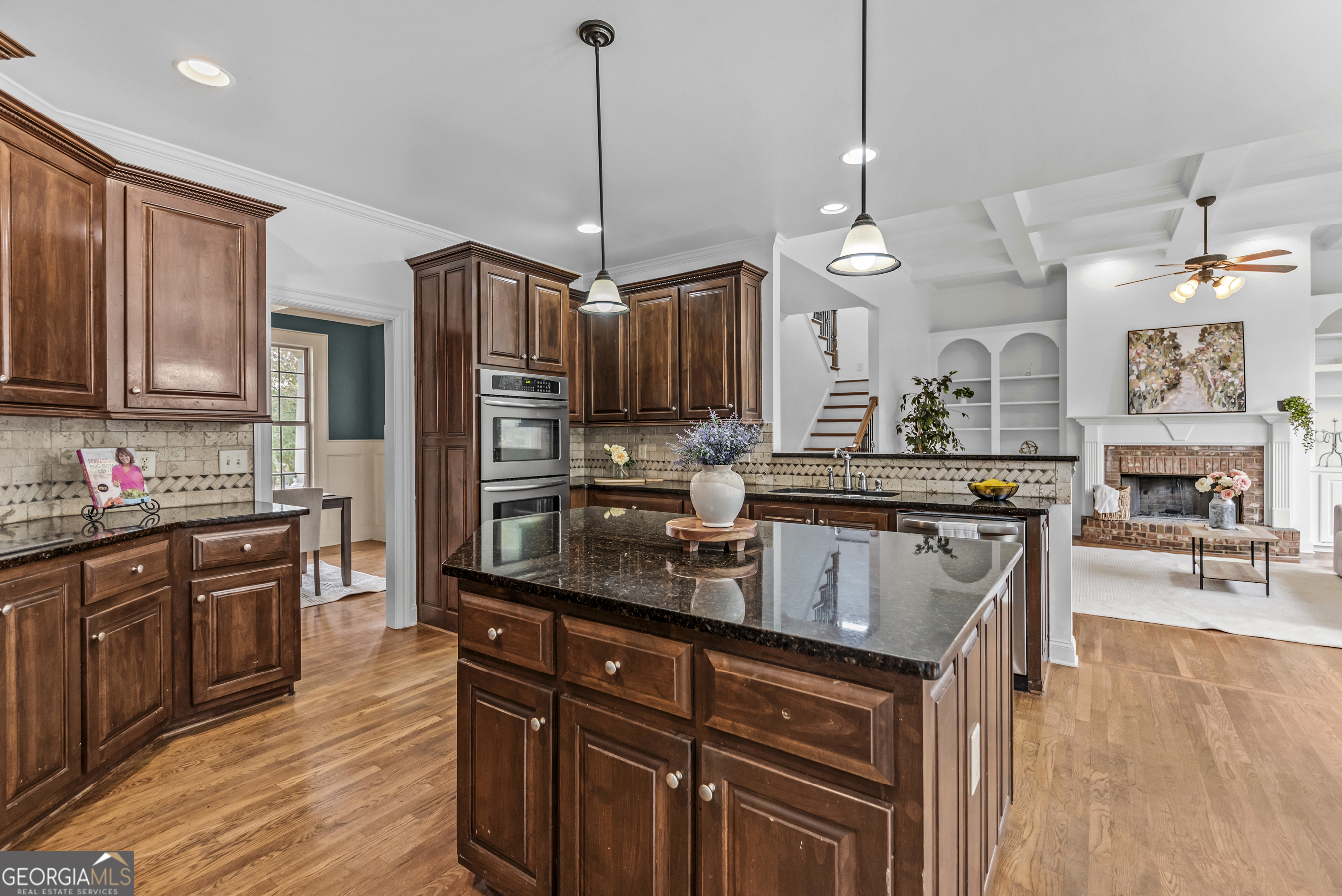 463 Delaperriere Loop Jefferson, GA 30549 - Photo 51 of 75 a kitchen with stainless steel appliances granite countertop a sink stove and refrigerator