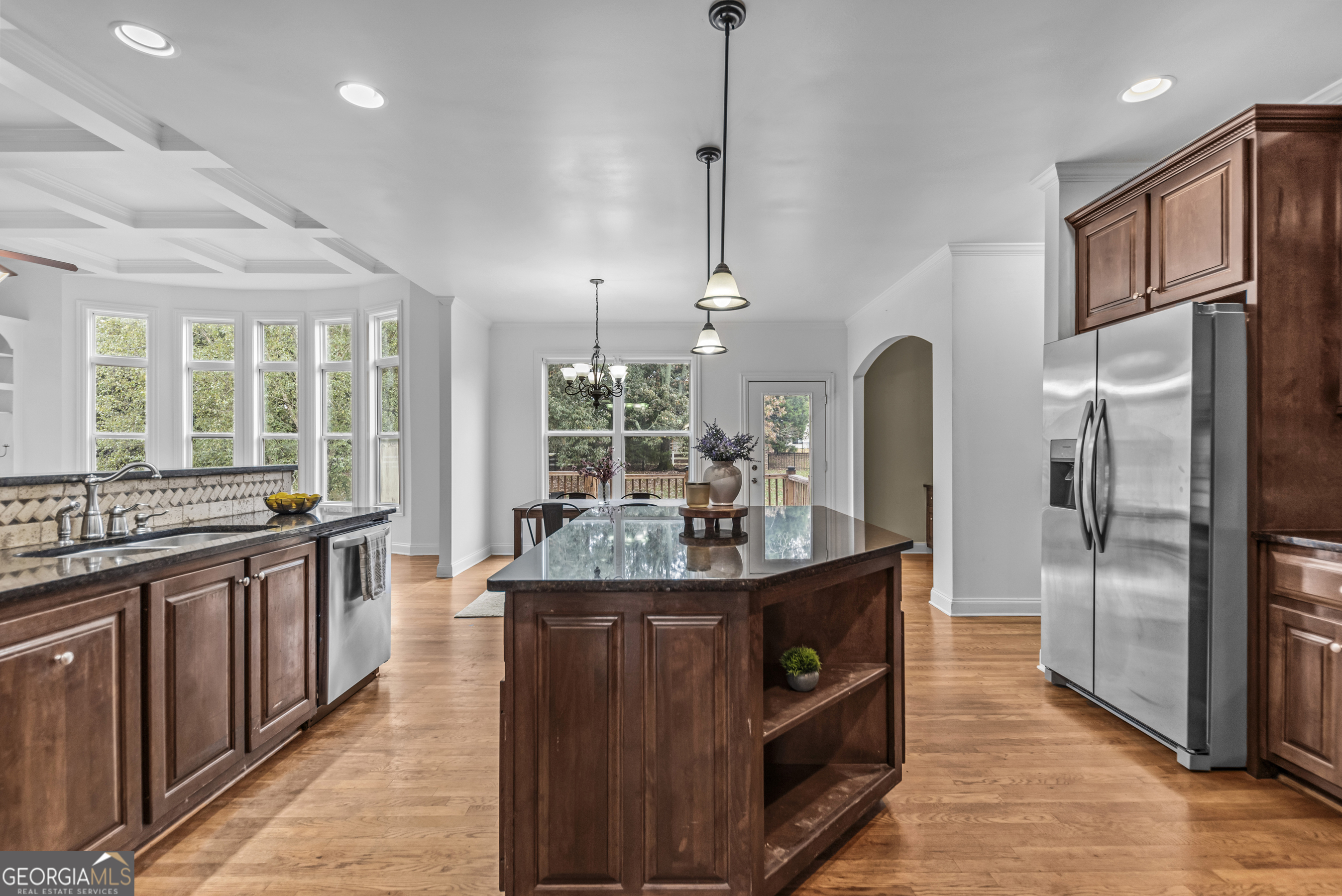 463 Delaperriere Loop Jefferson, GA 30549 - Photo 52 of 75 a kitchen with stainless steel appliances granite countertop a sink a stove and a refrigerator