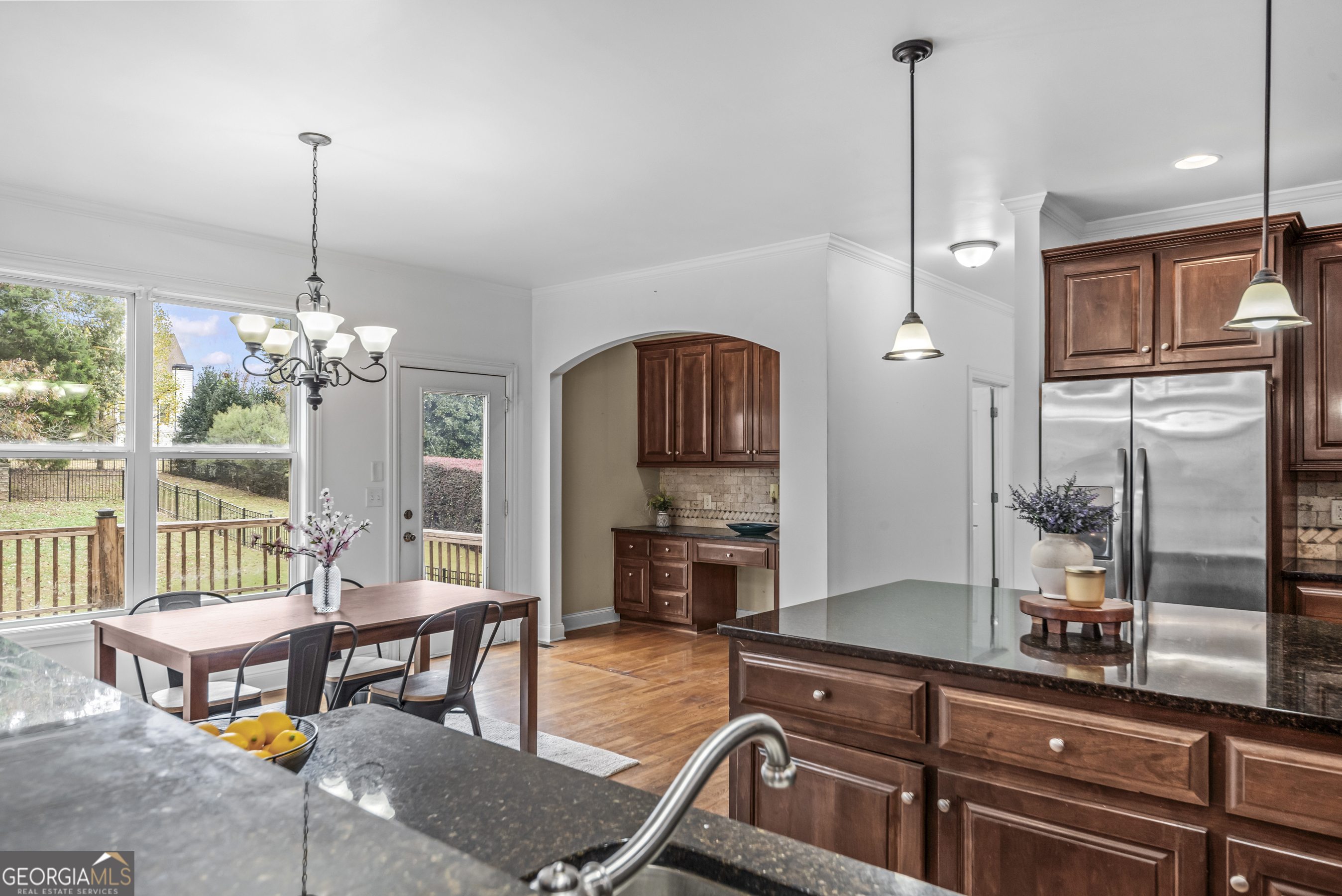 463 Delaperriere Loop Jefferson, GA 30549 - Photo 53 of 75 a living room with furniture a chandelier and a fireplace