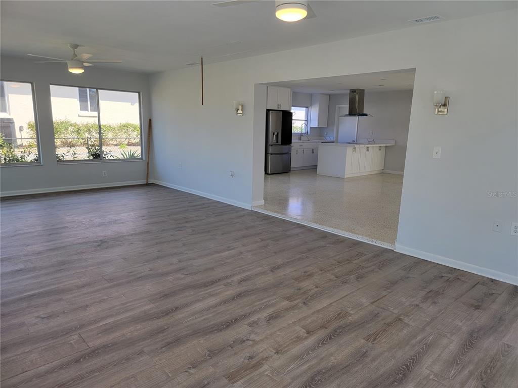 1732 Boca Raton Court Punta Gorda, FL 33950 - Photo 42 of 64 an empty room with wooden floor and windows