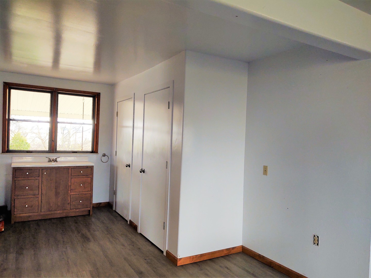 2950 Mt Zion Road Vienna, IL 62995 - Photo 11 of 36 a view of an empty room with window and wooden floor