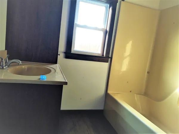 a bathroom with a sink and a bathtub