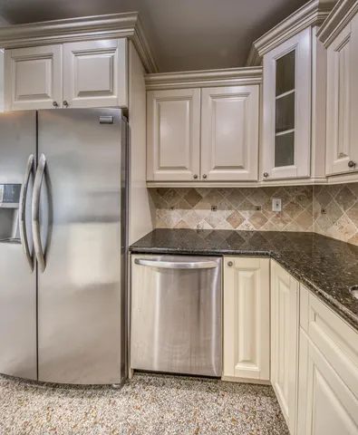 a kitchen with granite countertop a sink and a granite counter tops