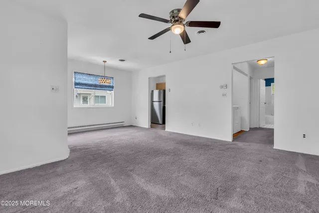 a kitchen with cabinets stainless steel appliances a sink and cabinets