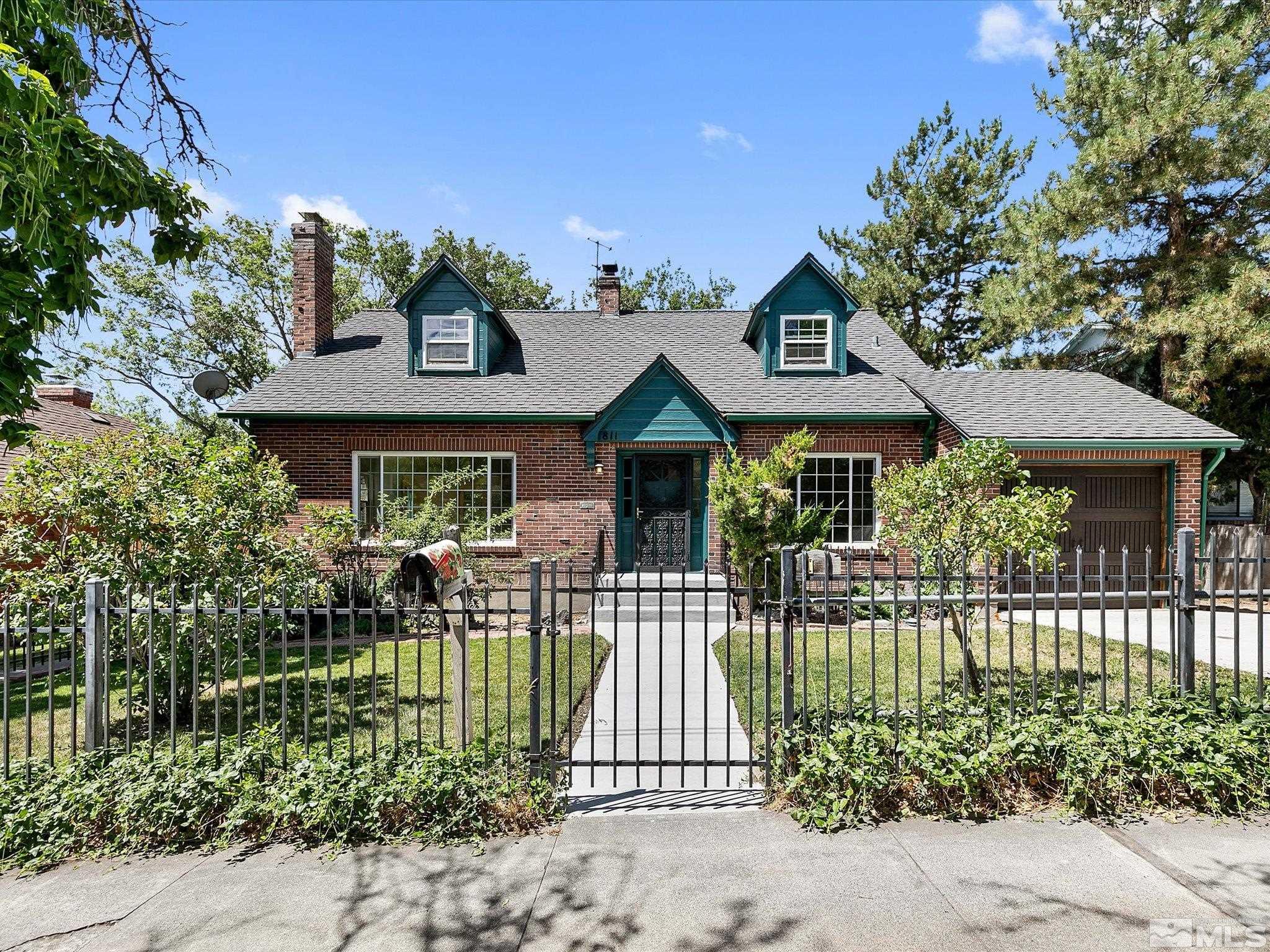 811 Washington Street Reno, NV 89503 - Photo 1 of 35 a front view of a house with a garden