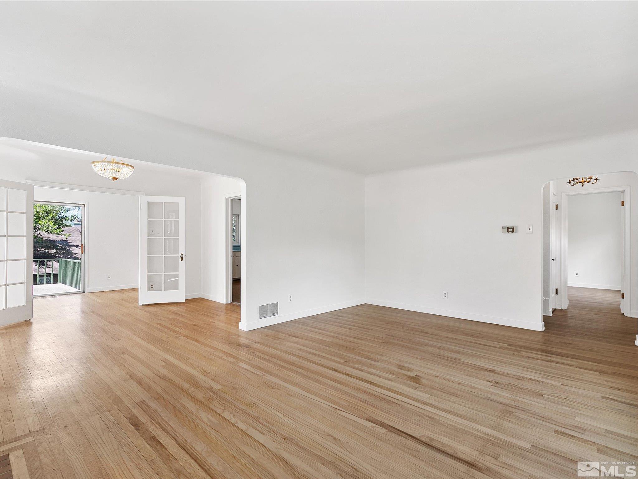 811 Washington Street Reno, NV 89503 - Photo 7 of 35 a view of an empty room with wooden floor