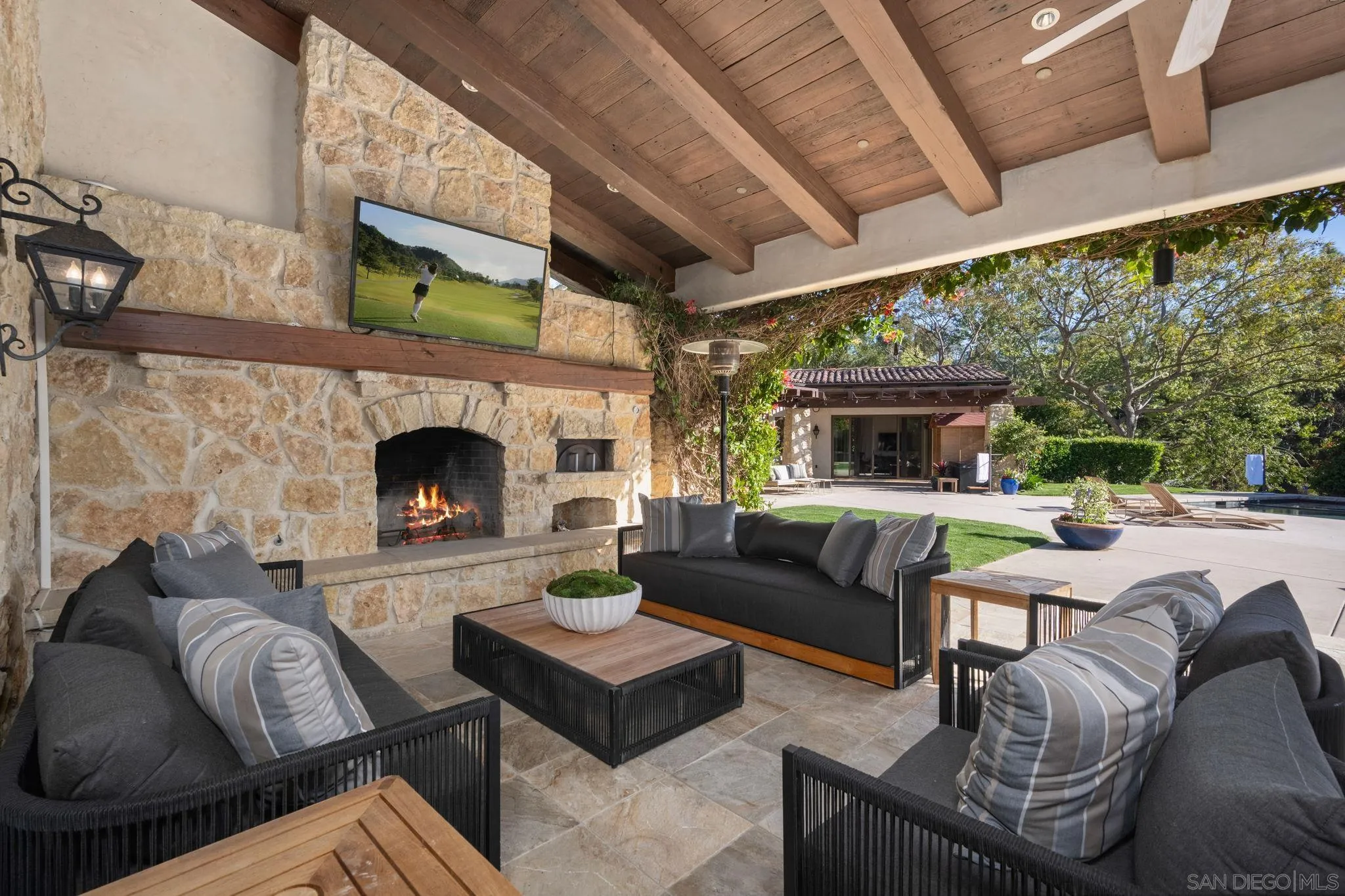 4505 La Noria Rancho Santa Fe, CA 92067 - Photo 10 of 28 Seamless indoor/outdoor living. Outdoor fireplace is a great place to enjoy sunset complete with pizza oven and summer kitchen.