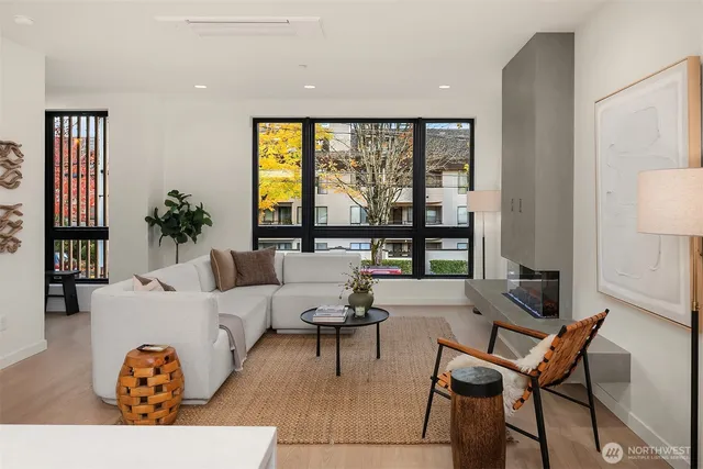 a living room with furniture and a large window
