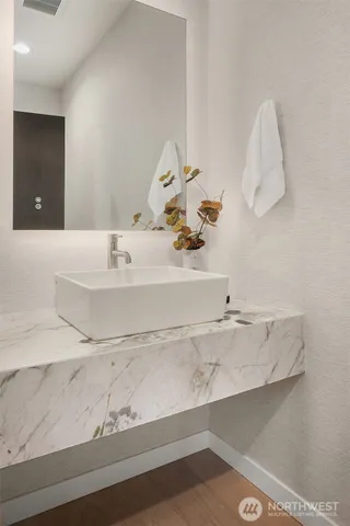 a bathroom with a sink and a mirror