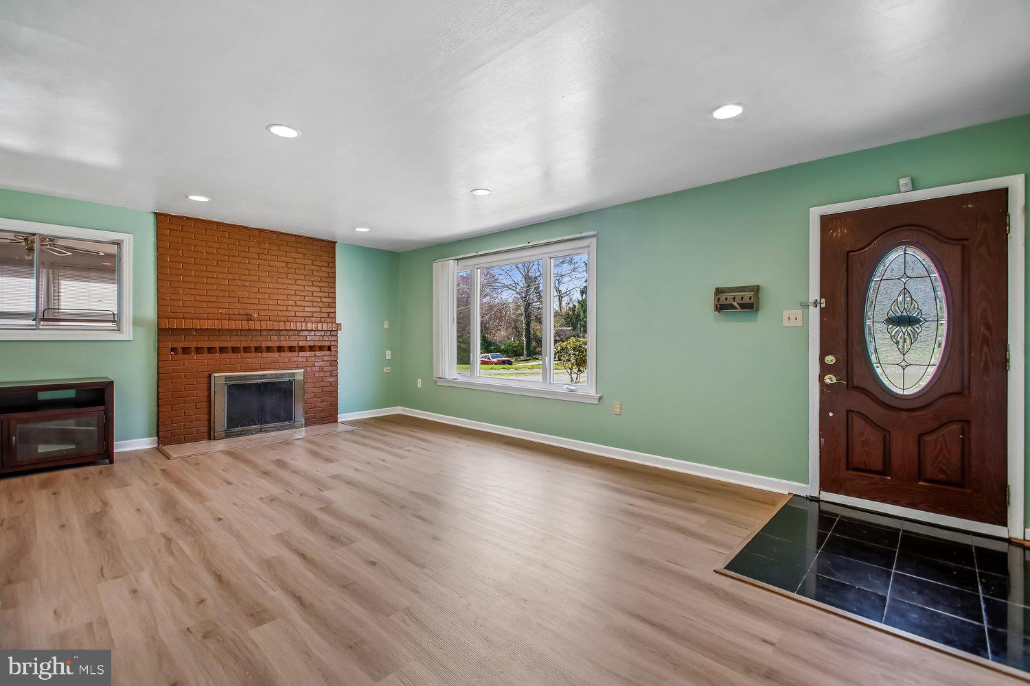 3610 Parklane Road Fairfax, VA 22030 - Photo 23 of 55 a view of an empty room with a fireplace and a window
