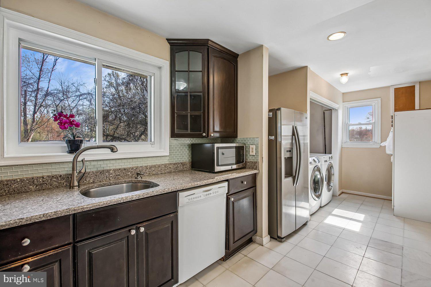 3610 Parklane Road Fairfax, VA 22030 - Photo 35 of 55 a kitchen with a refrigerator and a sink