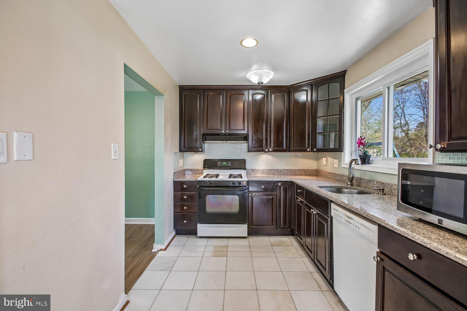 3610 Parklane Road Fairfax, VA 22030 - Photo 37 of 55 a large kitchen with stainless steel appliances granite countertop a stove and a sink