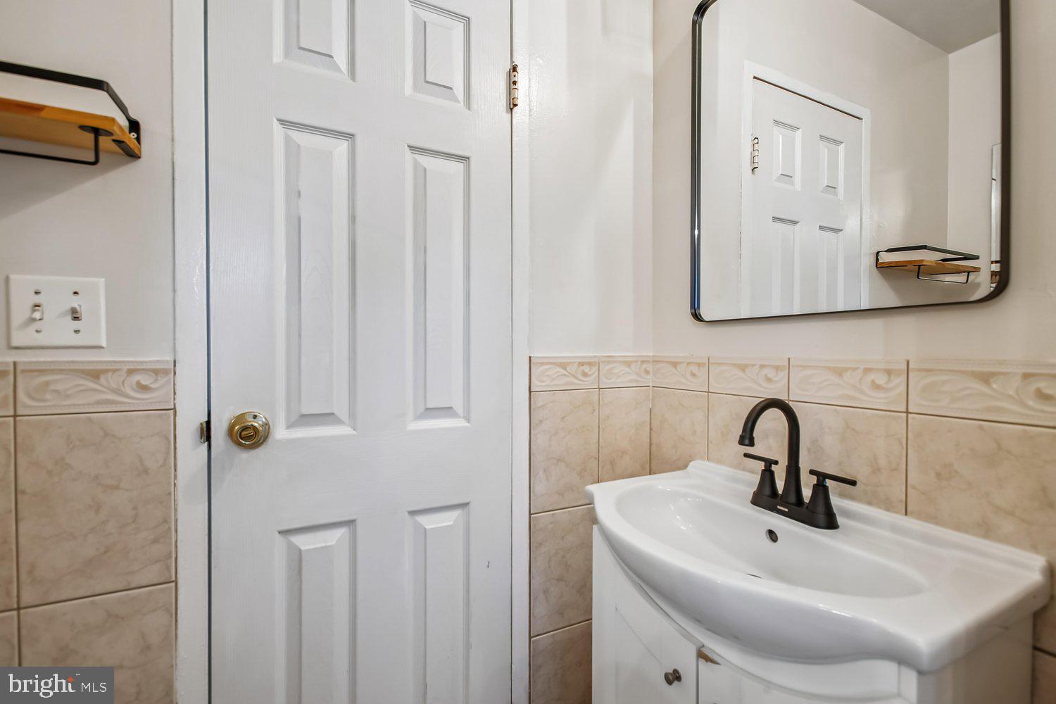 3610 Parklane Road Fairfax, VA 22030 - Photo 47 of 55 a bathroom with a sink and mirror