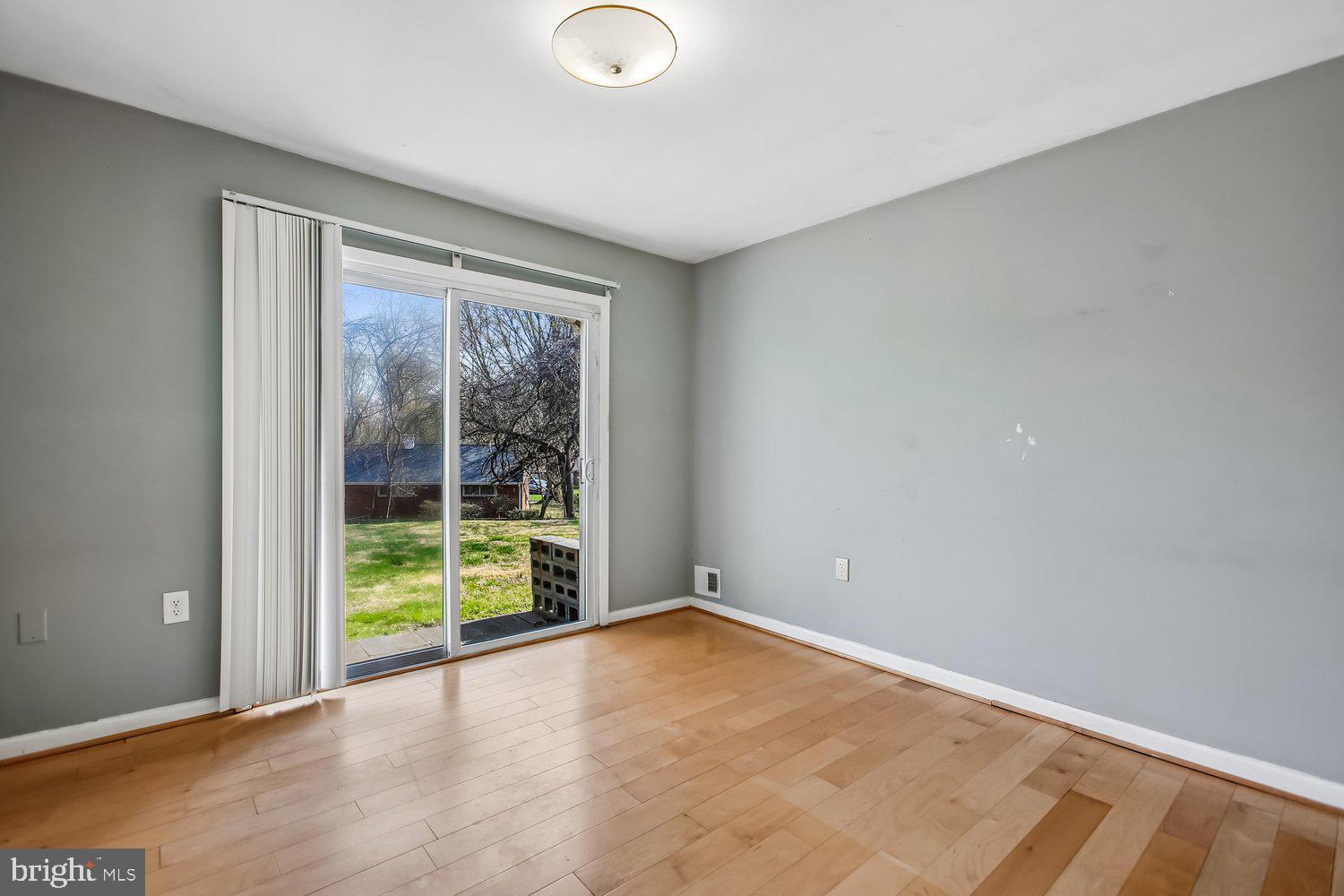 3610 Parklane Road Fairfax, VA 22030 - Photo 48 of 55 a view of an empty room with wooden floor and a window