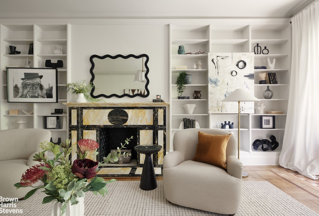 57 East 74th Street Manhattan, NY 10021 - Photo 9 of 60 a living room with furniture cabinets and a table