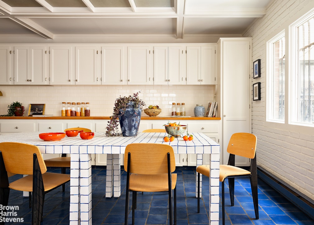 57 East 74th Street Manhattan, NY 10021 - Photo 14 of 60 a dining room with furniture and wooden floor