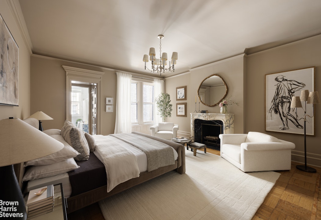 57 East 74th Street Manhattan, NY 10021 - Photo 18 of 60 a bedroom with bed and furniture with large windows