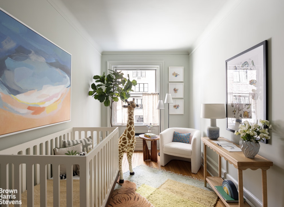 57 East 74th Street Manhattan, NY 10021 - Photo 26 of 60 a living room with furniture and a large window