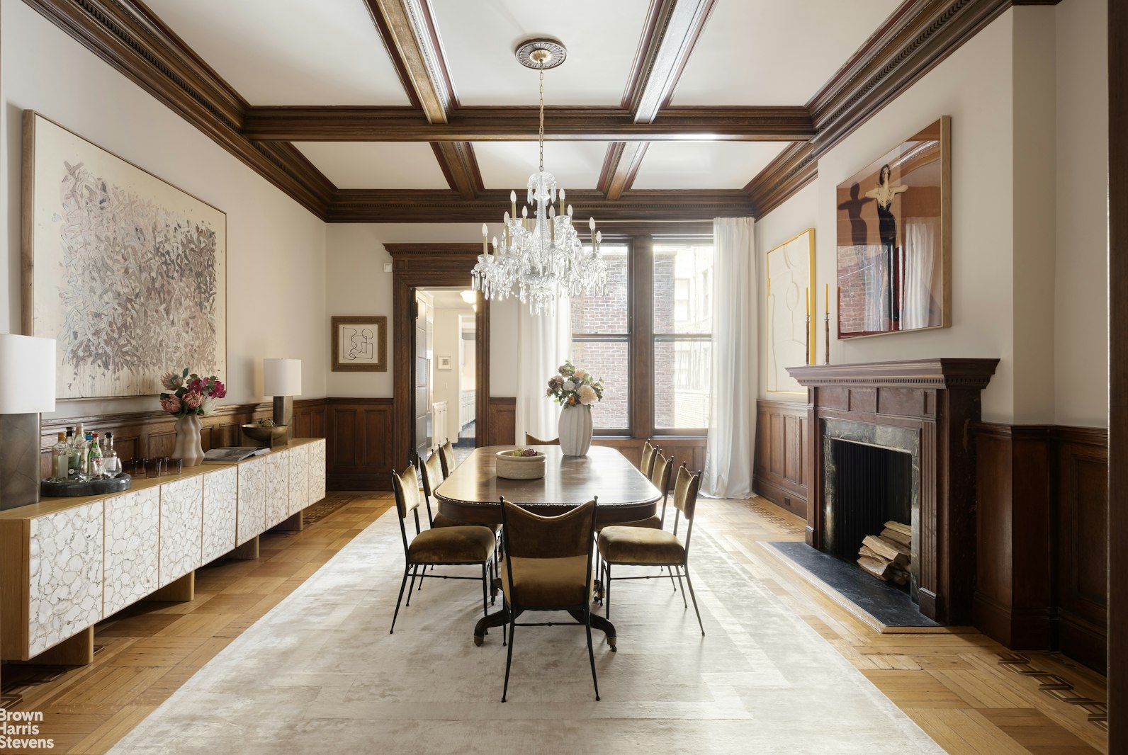 57 East 74th Street Manhattan, NY 10021 - Photo 36 of 60 a dining room with furniture a fireplace and wooden floor