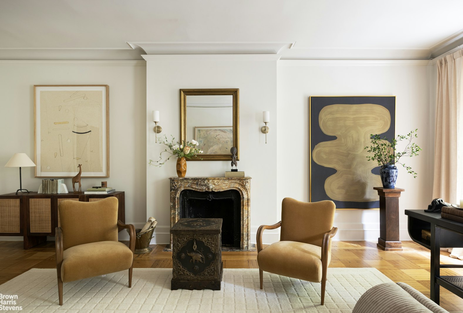 57 East 74th Street Manhattan, NY 10021 - Photo 41 of 60 a living room with furniture and a fireplace