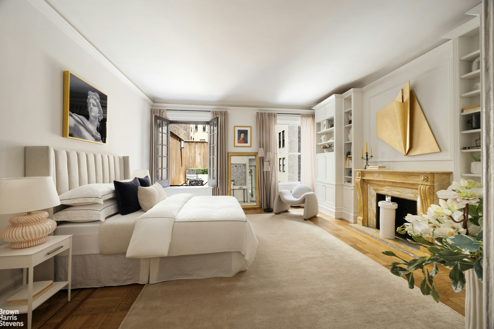 57 East 74th Street Manhattan, NY 10021 - Photo 48 of 60 a bedroom with a bed and a fireplace