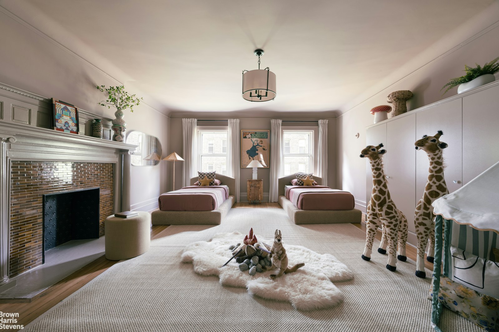 57 East 74th Street Manhattan, NY 10021 - Photo 49 of 60 a living room with furniture and a fireplace
