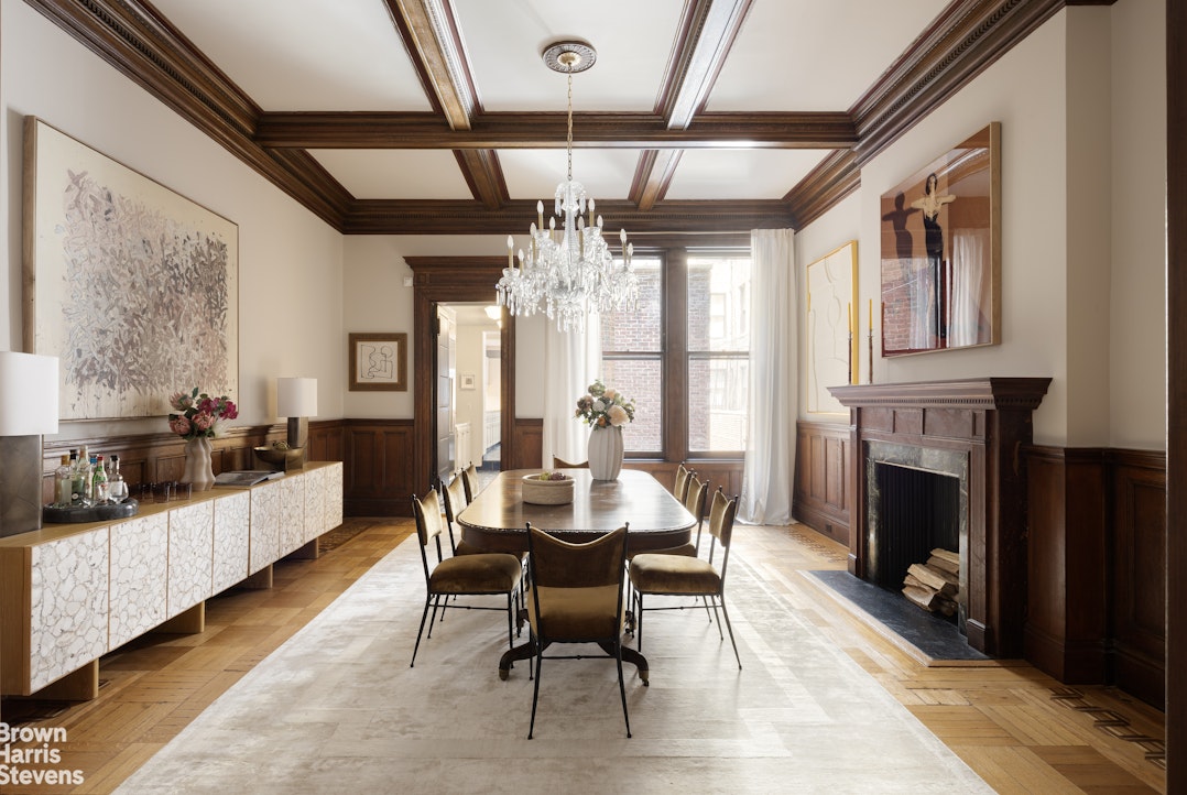 57 East 74th Street Manhattan, NY 10021 - Photo 6 of 60 a dining room with furniture a fireplace and wooden floor
