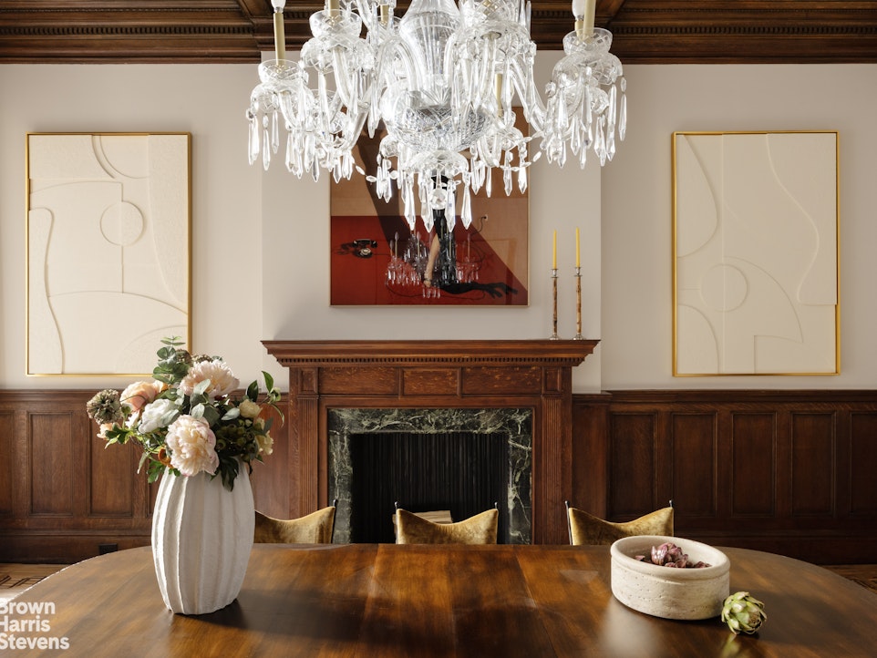 57 East 74th Street Manhattan, NY 10021 - Photo 7 of 60 a living room with furniture and a fireplace