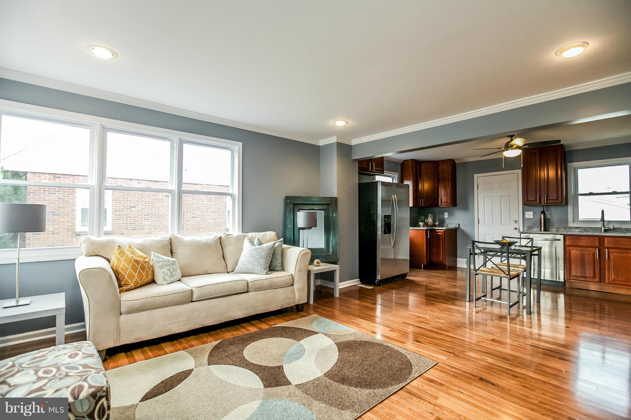 3534 Milford Mill Road Baltimore, MD 21244 - Photo 1 of 30 a living room with furniture and a large window