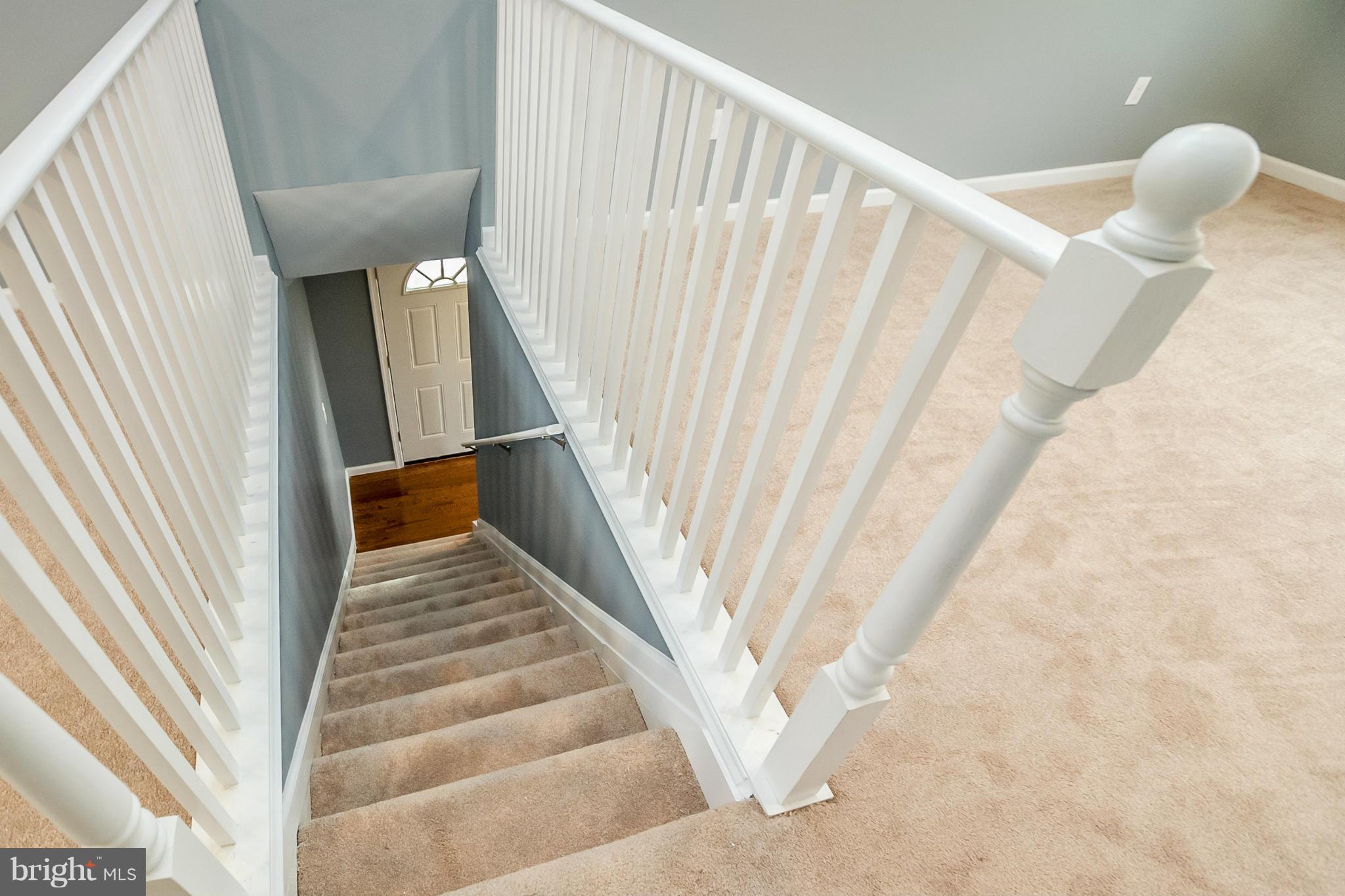 3534 Milford Mill Road Baltimore, MD 21244 - Photo 13 of 30 a view of staircase with railing and white walls