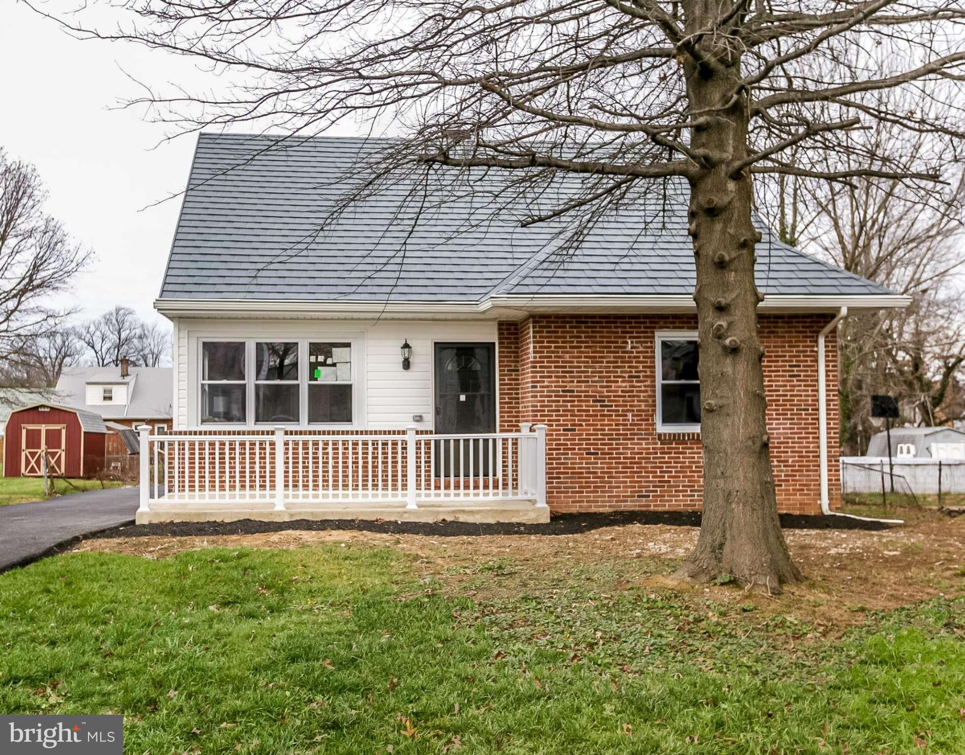 3534 Milford Mill Road Baltimore, MD 21244 - Photo 26 of 30 a front view of a house with garden