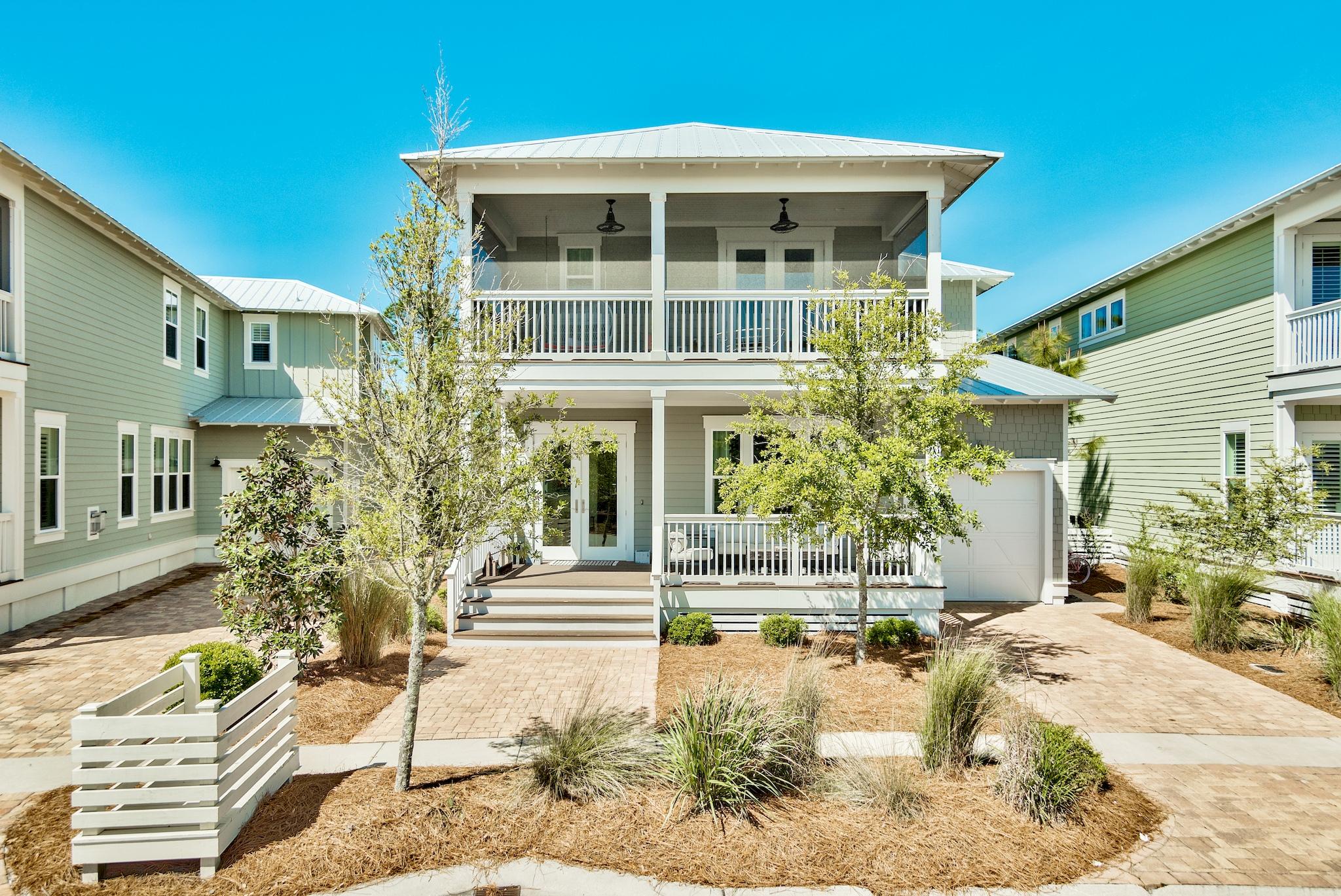 103 Flatwoods Forest Loop Santa Rosa Beach, FL 32459 - Photo 1 of 2 a front view of a house with a yard