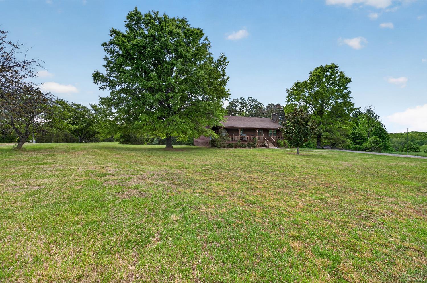 1002 Homeplace Road Rustburg, VA 24588 - Photo 38 of 48 a view of a house with a yard