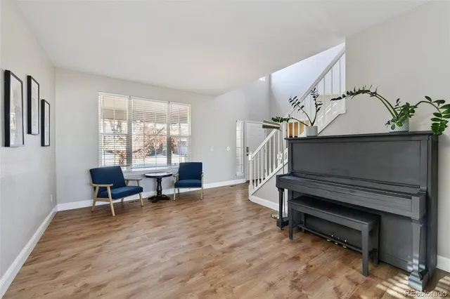 a view of entryway dining room and hall with wooden floor