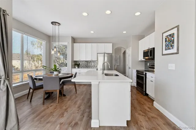 a open kitchen with sink cabinets and stainless steel appliances