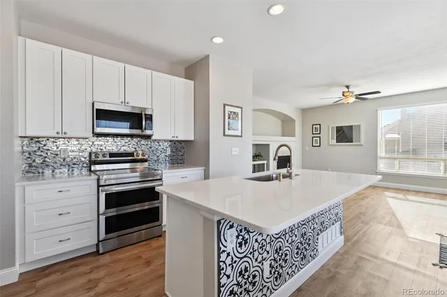a kitchen with a stove microwave and refrigerator