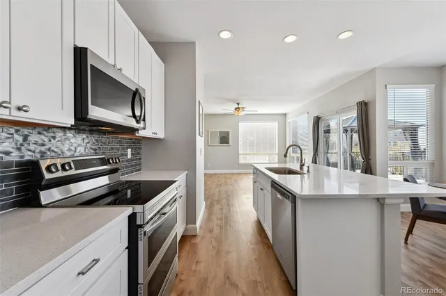 a dining room with furniture window and wooden floor