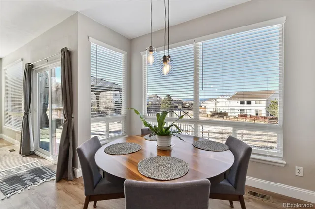 a view of an empty room with window and fire place