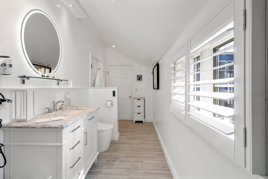19 Old Garden Road Rockport, MA 01966 - Photo 11 of 42 a bathroom with a double vanity sink and a mirror