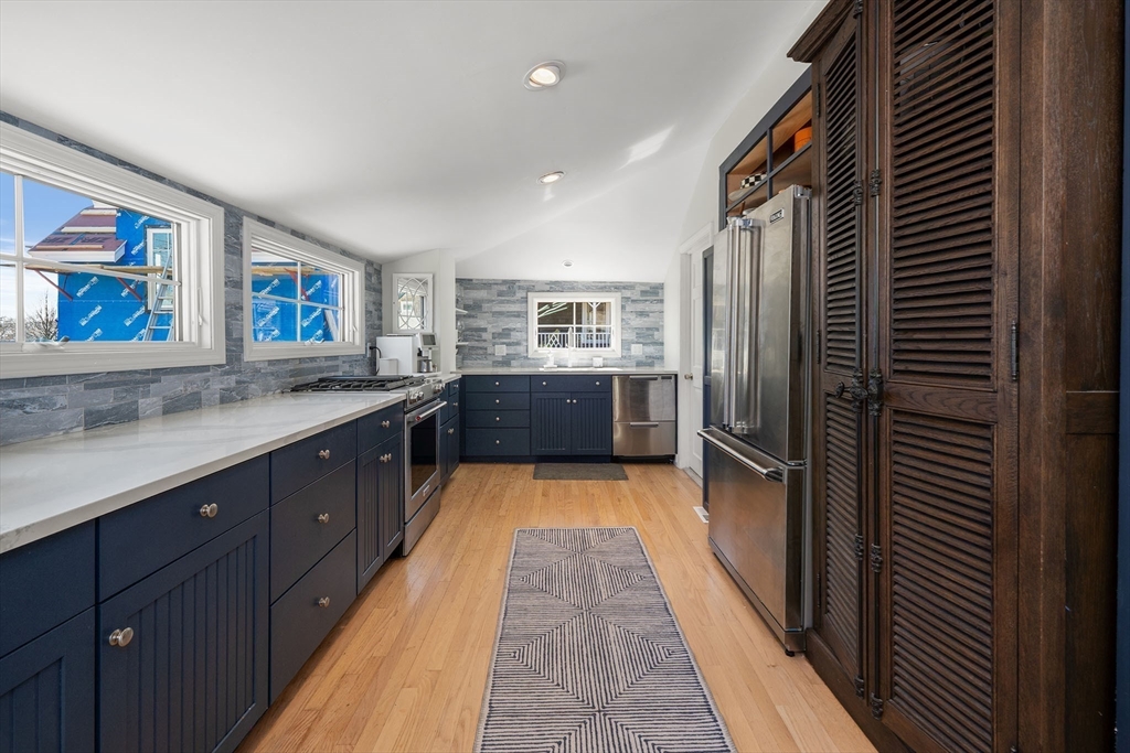 19 Old Garden Road Rockport, MA 01966 - Photo 12 of 42 a kitchen with stainless steel appliances a refrigerator and a sink