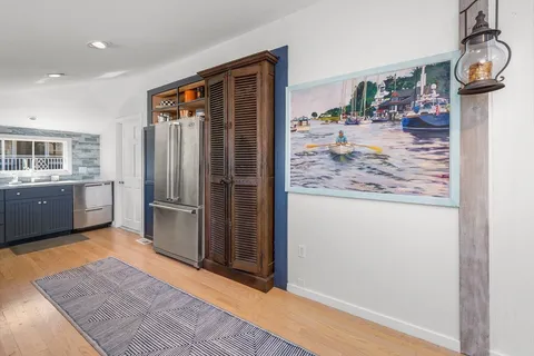 a view of a kitchen from the hallway