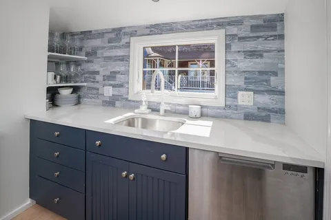 a kitchen with a sink and a window