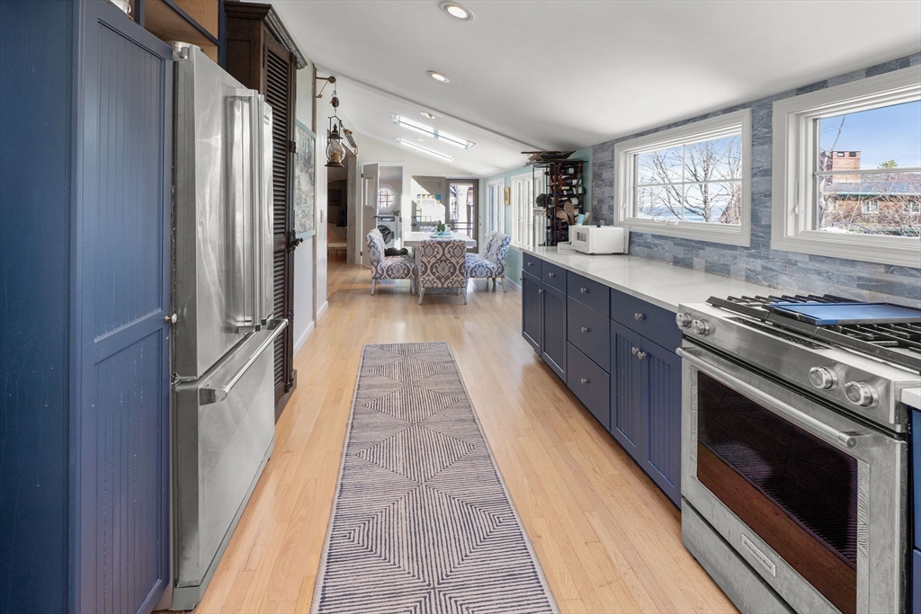 19 Old Garden Road Rockport, MA 01966 - Photo 16 of 42 a kitchen with stainless steel appliances granite countertop a stove a sink and a refrigerator