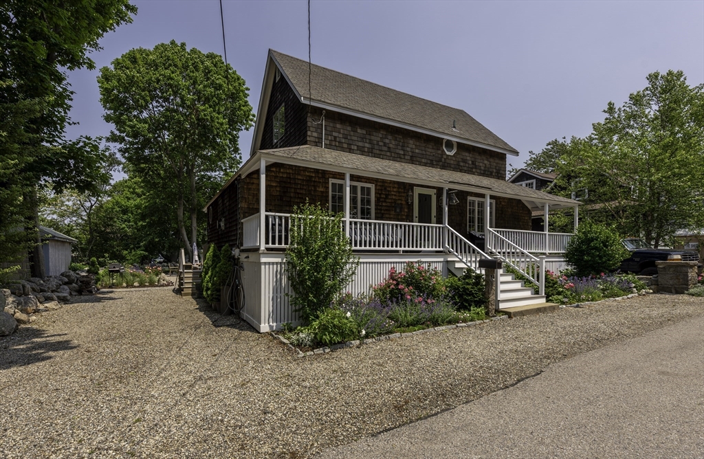 19 Old Garden Road Rockport, MA 01966 - Photo 2 of 42 a front view of a house with a garden