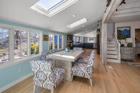 a very nice looking living room with a large window