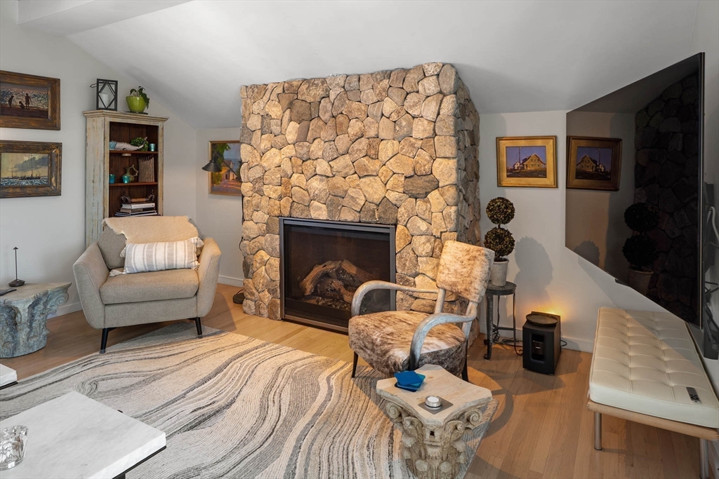 19 Old Garden Road Rockport, MA 01966 - Photo 29 of 42 a living room with furniture and a fireplace